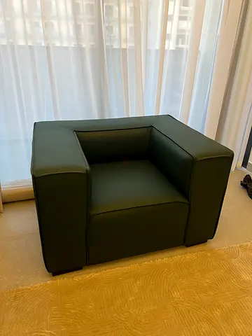 Green single-seater leather armchair