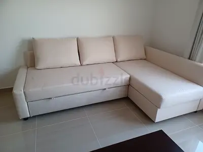 Beige L-shaped Sofa with Storage - Good Condition