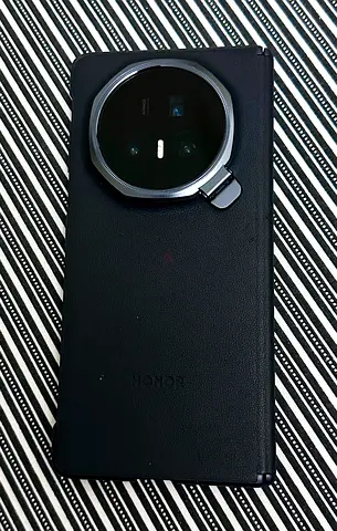 Honor Magic v5 foldable smartphone with protective flip case