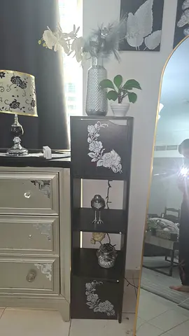 Tall narrow black display cabinet with floral design - slim storage unit