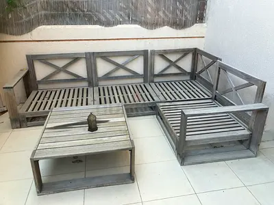Well used garden furniture and cushions