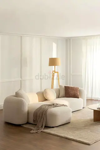 Modern curved -seater sofa with ottoman - cream boucle