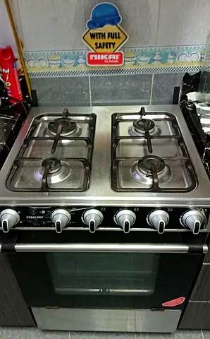 Used 4-Burner Gas Cooker with Oven - Stainless Top cast ion