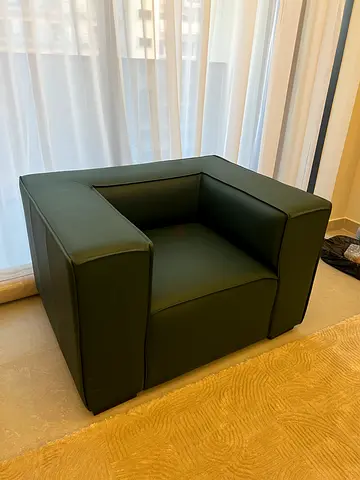 Green single-seater leather armchair