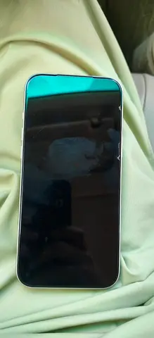 Used iPhone with screen protector — needs minor touch-up