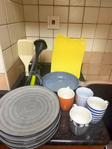 Kitchen dinnerware set: plates, mugs, utensils & cutting board (used)