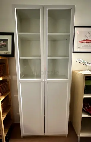IKEA tall display cabinet in perfect condition .