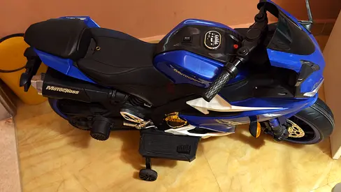 Blue electric ride-on sports bike for kids with training wheels