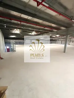 A large warehouse with a mezzanine is available for rent in Al Jurf 2 Industrial Area, Ajman. It fea
