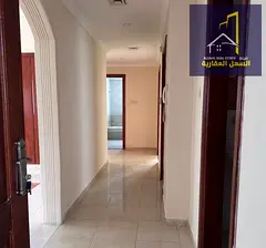 A Special Residential Opportunity in Al Qasimia, Sharjah Two-bedroom apartment with a living room an