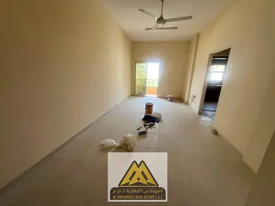 1BR in Al Rashidiya 1 with balcony, no AC, near Ramada Black. AED 26,009/year, 4 payments.