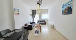 Furnished 1-Bedroom Apartment with Living Area – Partial Garden & City Views – Parking Included