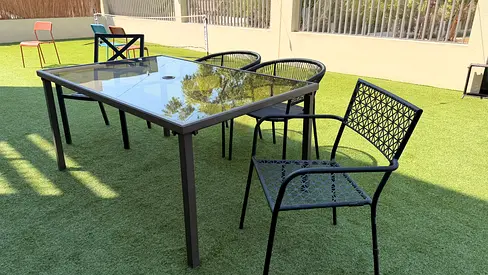 Outdoor glass-top dining table with 4 metal chairs - Made in the USA