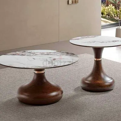 Pair of modern round coffee/side tables with marble tops and brown metal bases