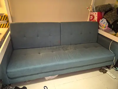 Blue fabric three-seater sofa bed - good condition