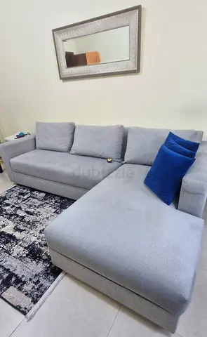 Light grey L-shaped sofa with chaise, good condition