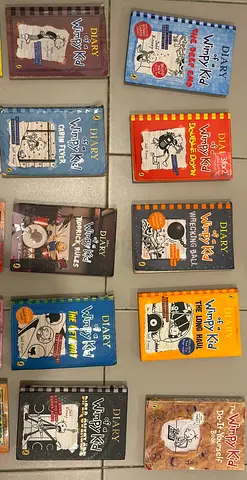 Collection of 12 'Diary of a Wimpy Kid' paperback books - assorted editions