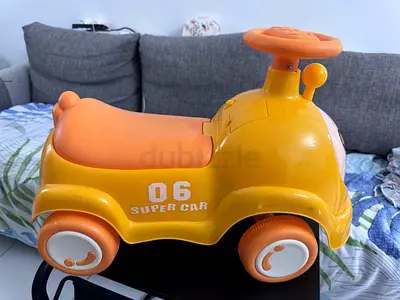 New and hardly used toddler ride-on push car - orange '06' compact model