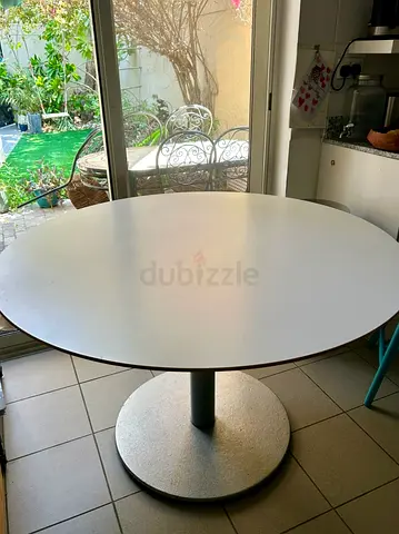 Round white wood dining table with central metal pedestal base - super sturdy