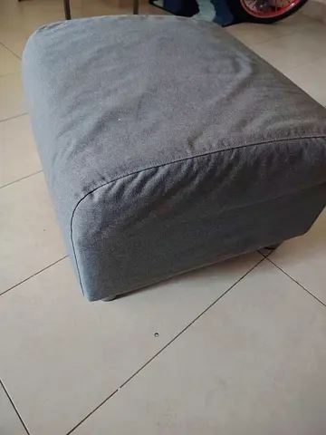 Grey fabric ottoman / footstool in good condition