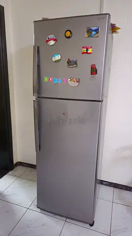 Used Silver Double-Door Refrigerator with Top Freezer - Good Working Condition