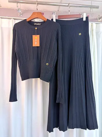 Black ribbed knit two-piece set – long skirt and matching top, size tag attached