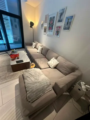 Large L-shaped beige fabric sectional sofa with chaise - good condition- needs refurbishing