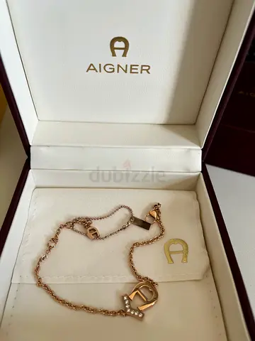 Aigner rose gold logo bracelet in original box — gently used