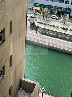 3-Bedroom Enclosed Apartment with Hall for Annual Rent in Al Qasba, Sharjah | Large Foyer | Divided