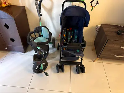 Lightweight navy stroller with matching toddler tricycle .tryi cycle is free