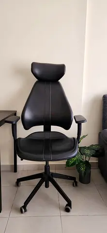 Black ergonomic office chair with headrest and wheels - good condition