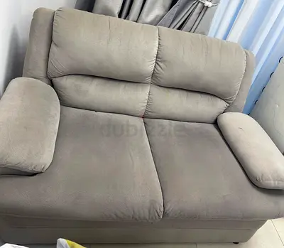 2-seater grey fabric loveseat in good used condition
