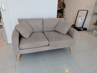Home Center Compact 2-Seater Beige Fabric Sofa with Wooden Legs
