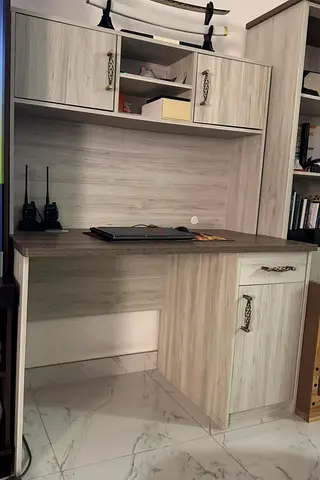 Light wood study desk with overhead storage and cabinet with chair
