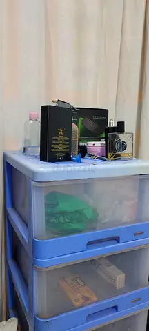 Blue plastic 5-drawer storage organizer with items - good condition ,