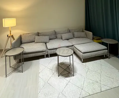 Light grey L-shaped sectional sofa Ikea