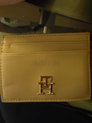 Beige compact leather wallet with gold logo - gently used
