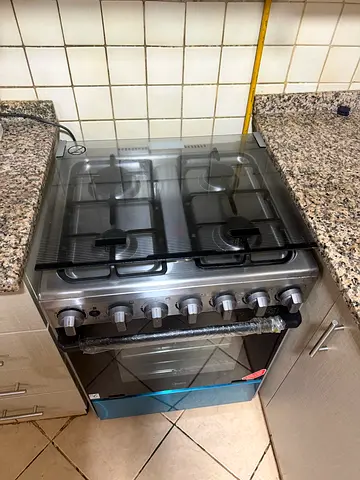 Stainless Steel 4-Burner Gas Cooker with Oven - Good Condition