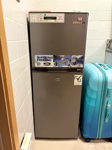 Used silver double-door refrigerator - good working condition