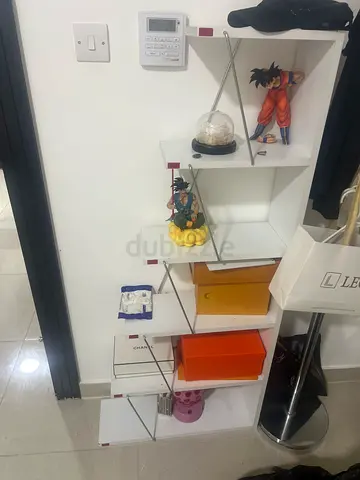 White modular cube shelving unit with metal supports
