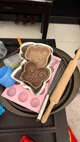 Assorted baking tools set — silicone molds, whisk, rolling pin, baking pan