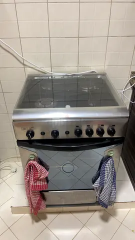 Used stainless steel gas cooker with oven and glass top - good condition