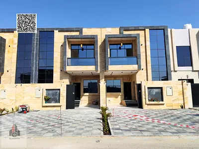 Townhouse for sale featuring a distinctive stone façade; price includes registration fees.