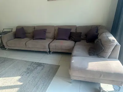 Light brown fabric L-shaped sectional sofa with chaise, good condition
