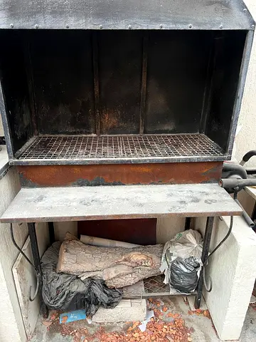 Used built-in charcoal/wood grill with hood