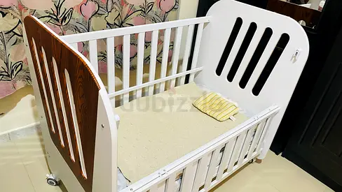 Urgent selling.. White Wooden Baby Crib with Wheels - Good Condition urgent sell