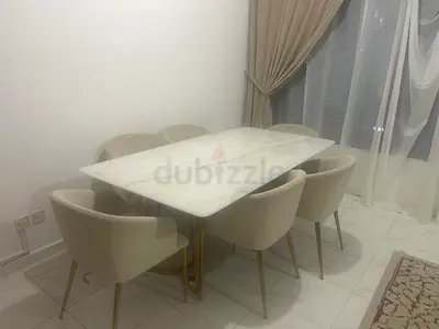 Marble-top dining table with 6 upholstered chairs - gently used