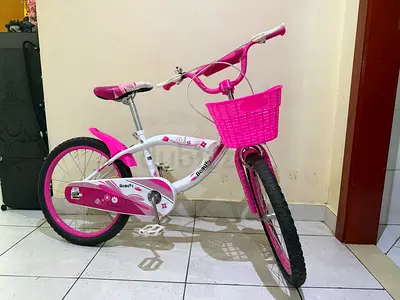 Pink kids bicycle with basket - good condition