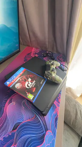 Sony PS4 Slim with DualShock Controllers and Gran Turismo 7