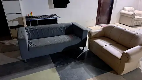Two-seater sofas set — grey fabric and beige leather, used